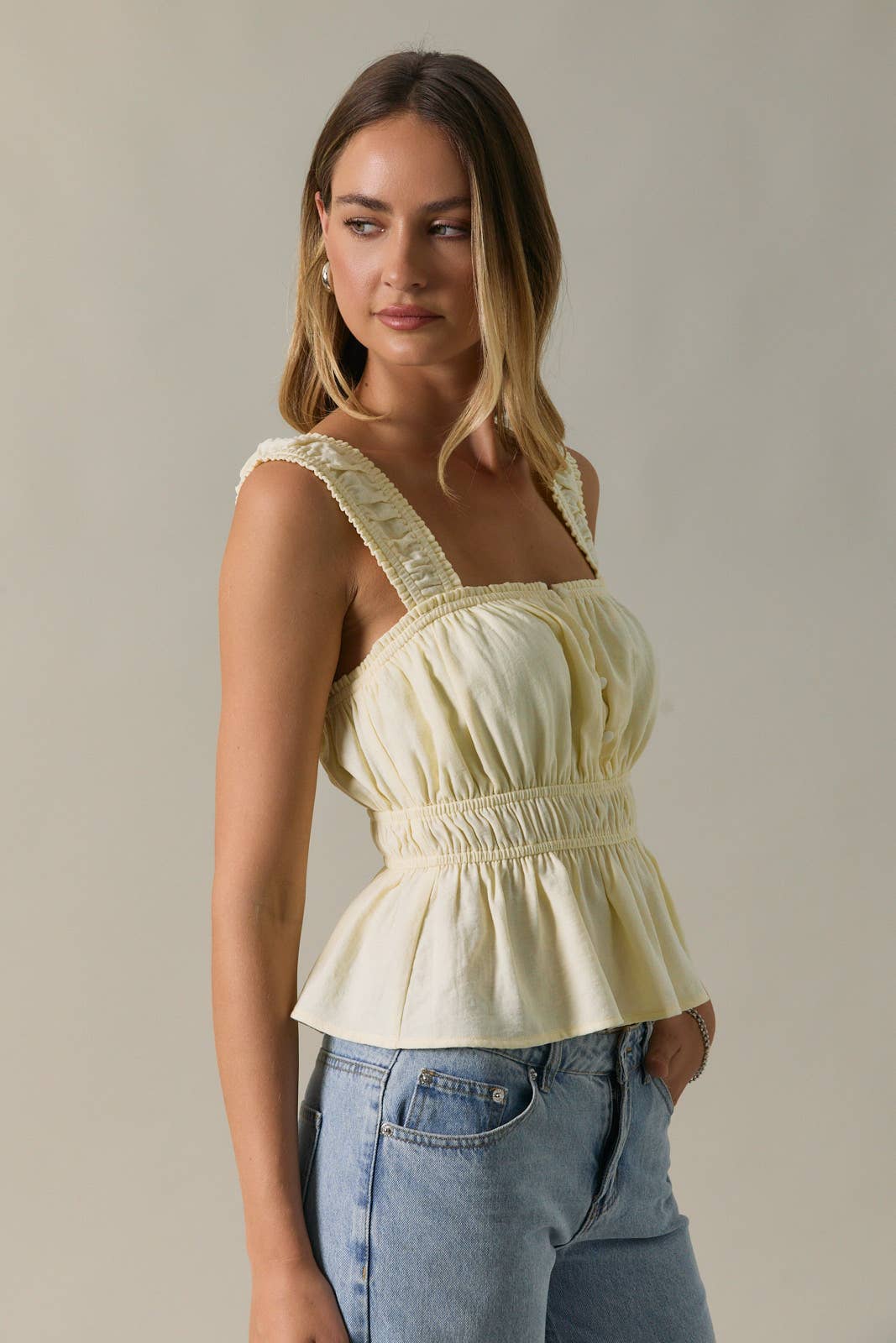 SLEEVELESS PEPLUM TOP