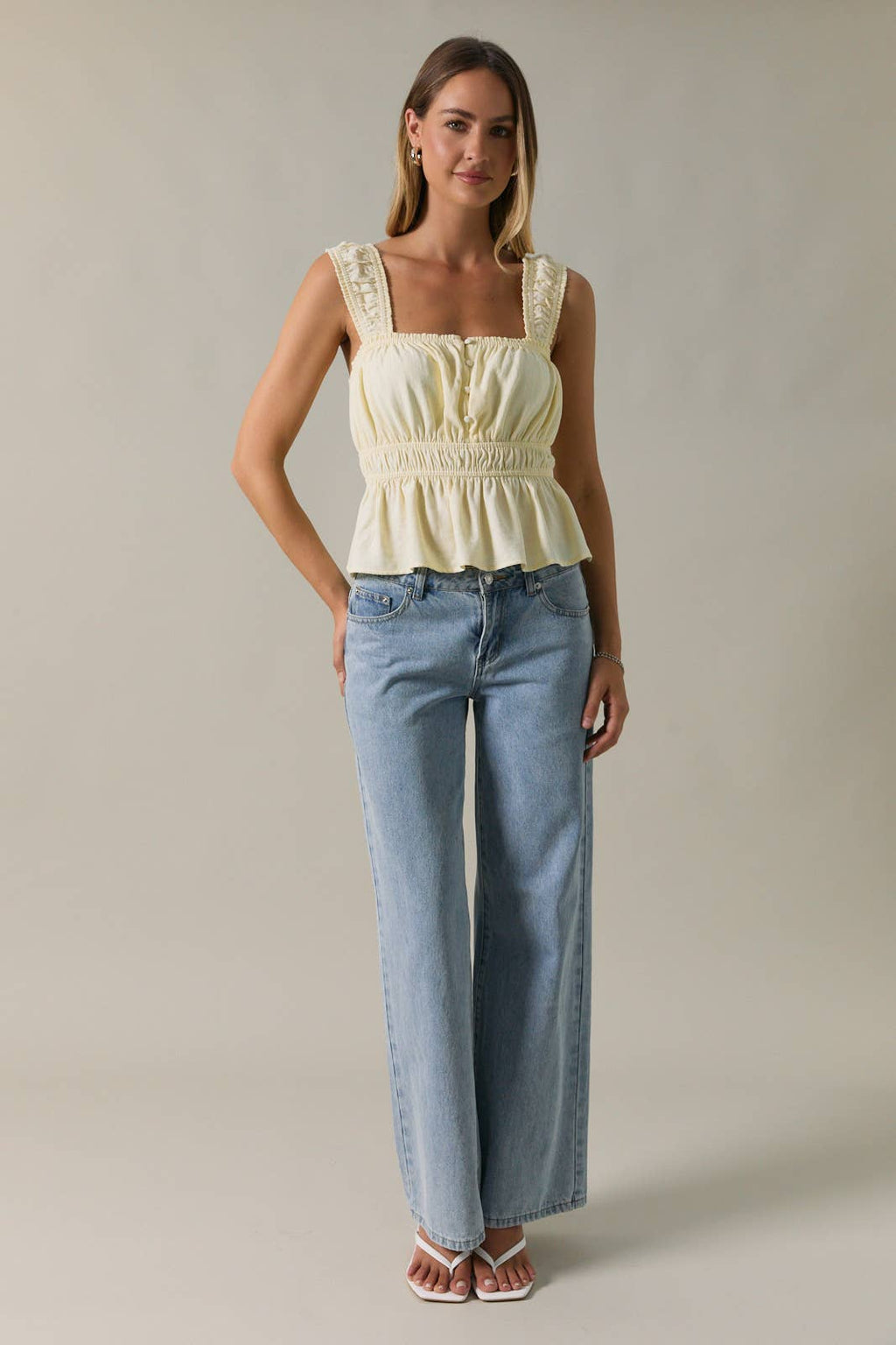 SLEEVELESS PEPLUM TOP