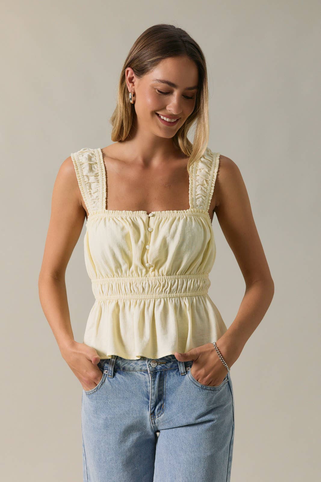 SLEEVELESS PEPLUM TOP