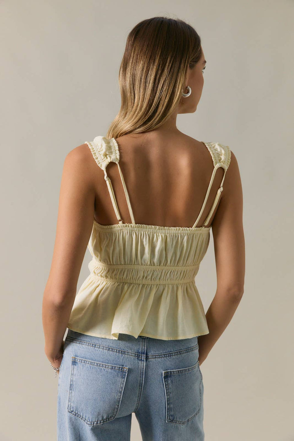 SLEEVELESS PEPLUM TOP